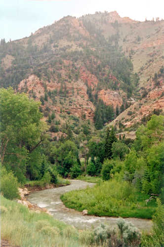 The Huntington River Flowing Beneath Sparsely Forested Canyon Walls