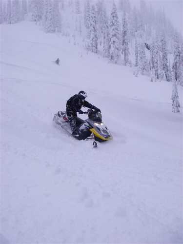 Snowmobiling Down Steep Slopes