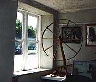 Spinning Wheel on Display Inside Old Store in Franklin