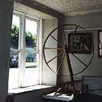 Spinning Wheel on Display Inside Old Store in Franklin