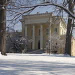A Snow-blanketed Evergreen House and Museum