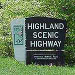 An entrance sign greets visitors to the Highland Scenic Highway